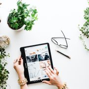 hands-scrolling-social-media-on-a-tablet