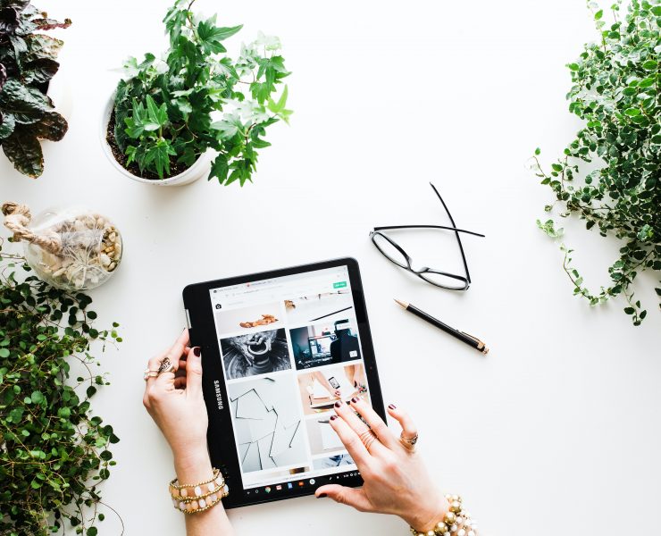 hands-scrolling-social-media-on-a-tablet