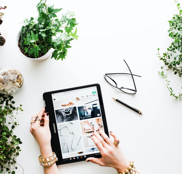 hands-scrolling-social-media-on-a-tablet