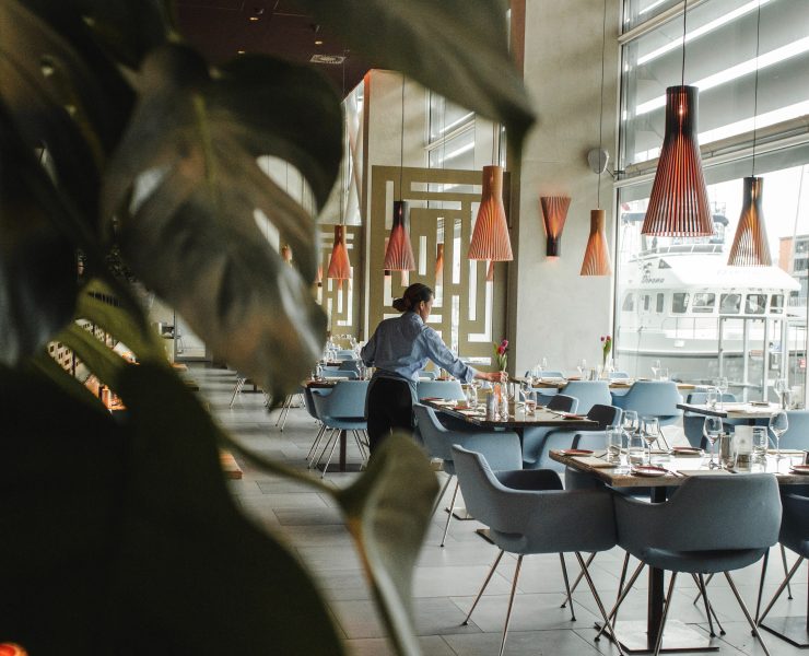 hotel employee tending to tables