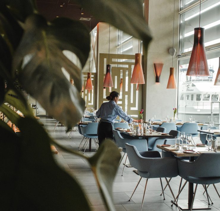 hotel employee tending to tables
